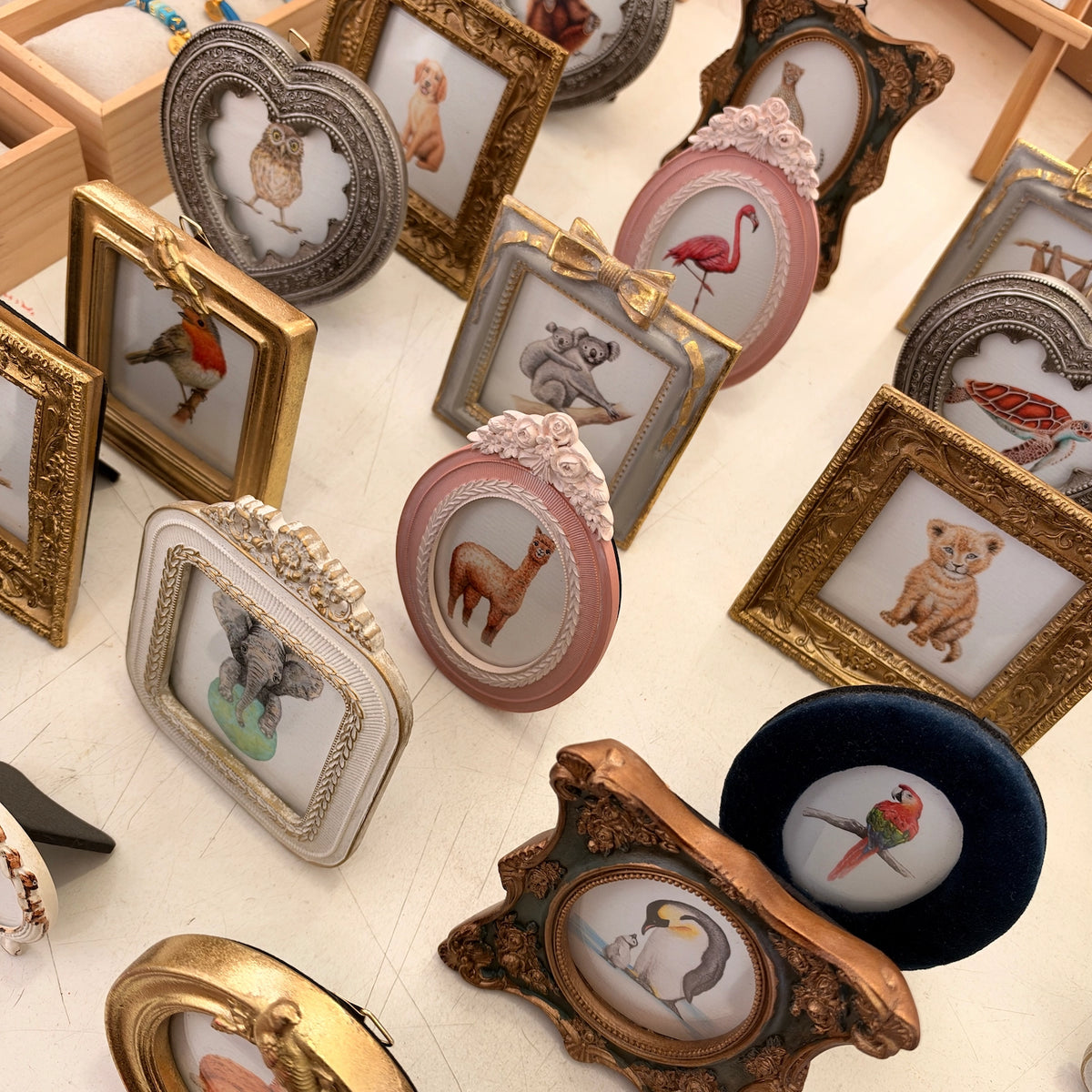 Gold colored bird frame with sloth art print