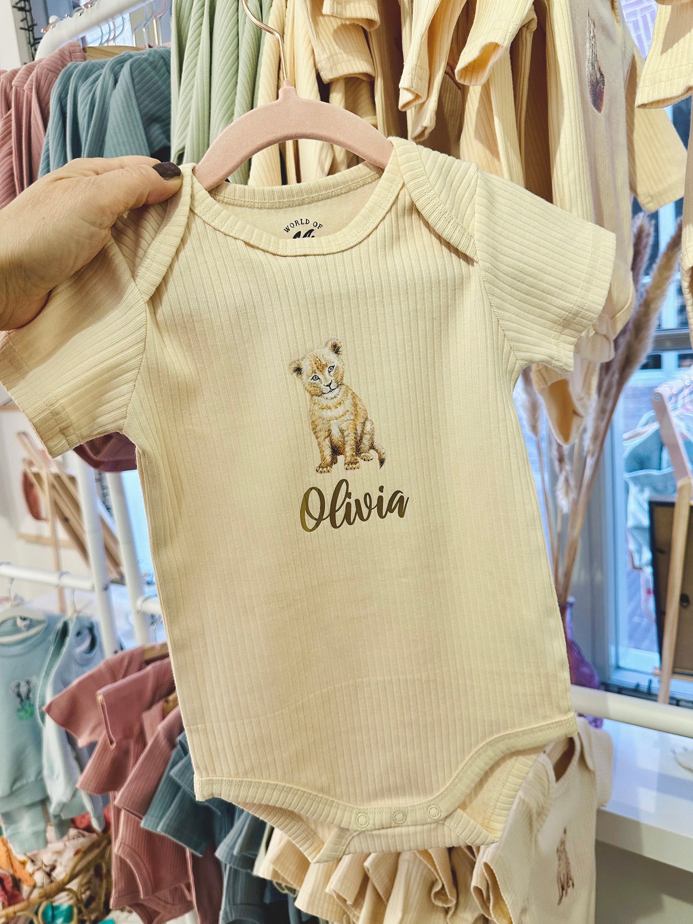 Baby onesie with little lion and name - vanilla short sleeve