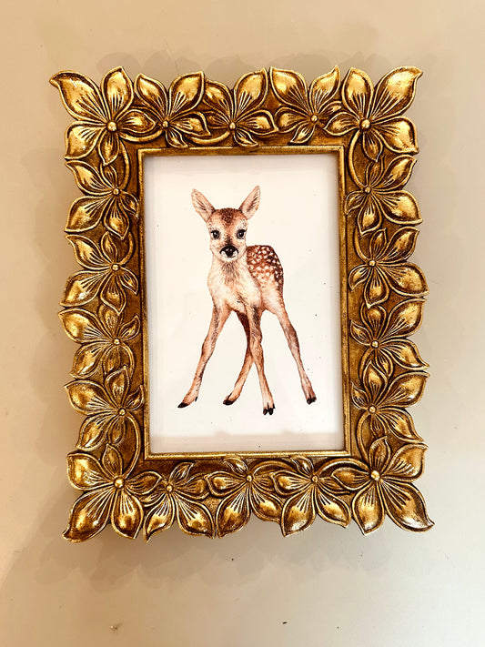 Gold-colored flower frame with deer art print